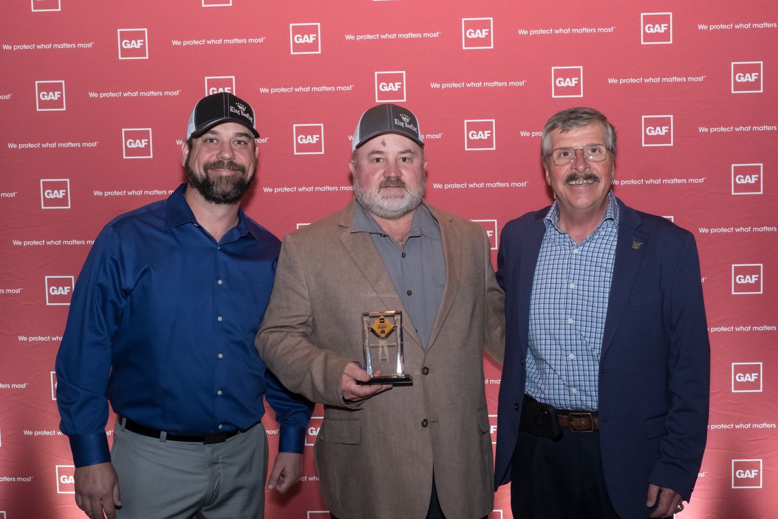 King Roofing & Solar Images - Owners at GAF Award reception with Master Select Award